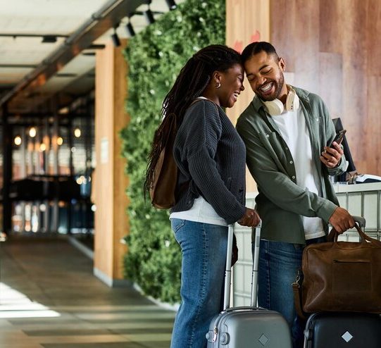 young-african-american-couple-checks-hotel-lobby-excited-vacation-getaway_1192423-3487